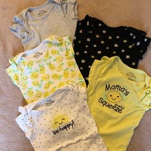 Five baby onesies